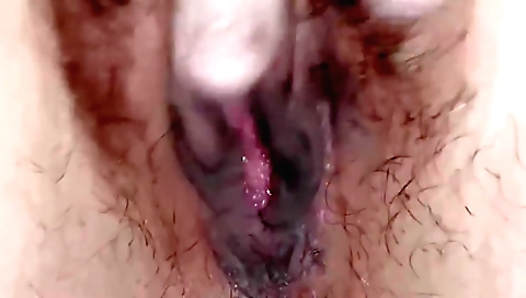 Hairy indian girl is sitting on a chair and showing her pussy