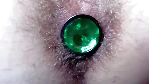 Solo female with a butt plug on her ass fucks in the toilet