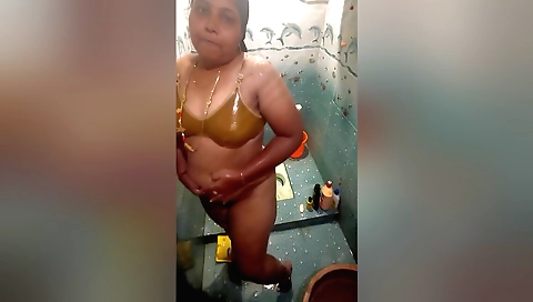 Indian chick uses bathroom as a good time to make herself wet