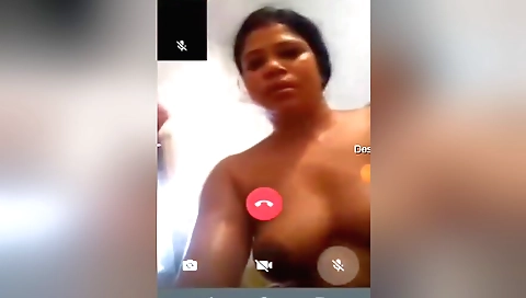 Hot brunette shows her body and hair in front of the webcam