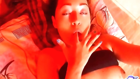 Latina slut rides and masturbates with a dildo in the bedroom