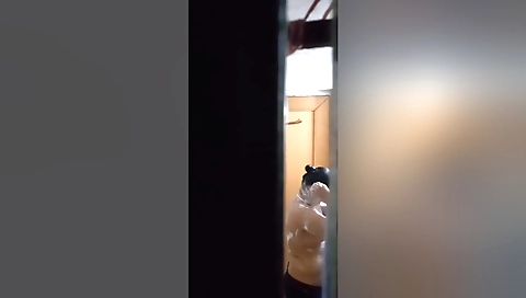 Busty girl with a nice body is filmed by a cameraman