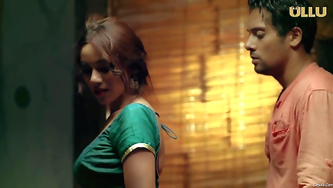 A brunette in a sexy outfit blows a cock in her bedroom