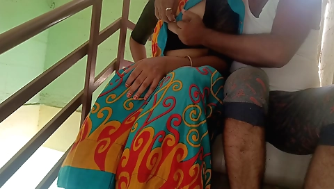 Wife in green bikini in the balcony with house owner