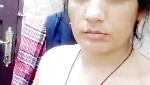 Indian housewife is showing off her big tits on web cam