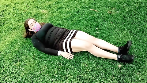 Busty brunette amateur girl enjoying herself in the park