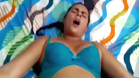 Amateur brunette is playing with her phone and getting a blowjob