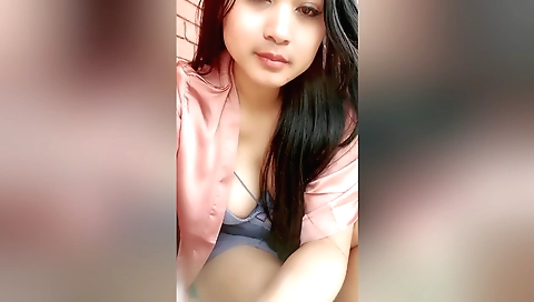 Outdoor solo movie of an attractive chick in a red dress