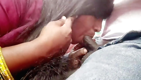 Indian brunette babe with big tits giving a blowjob