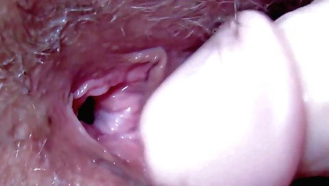 Sexy girl with a hairy pussy and a nice ass fucks her hairy pussy