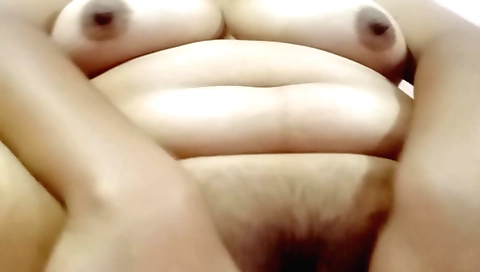 Perfectly hairy brunette is masturbating in front of the camera