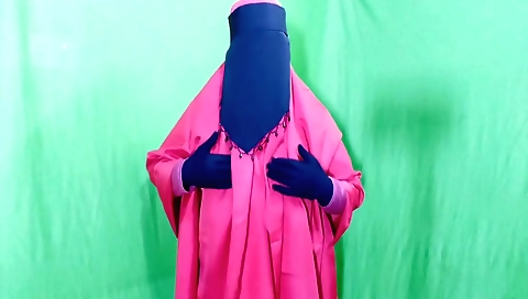 A girl in black is showing off her body in a bedroom