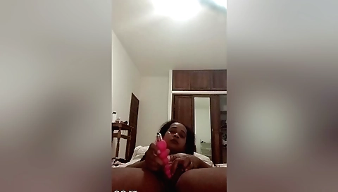 Brunette with round ass is on her knees on a couch