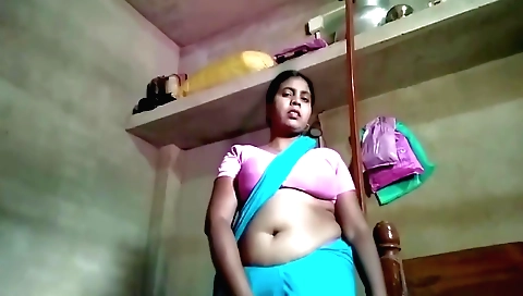 Indian solo woman showing herself in her pink dress